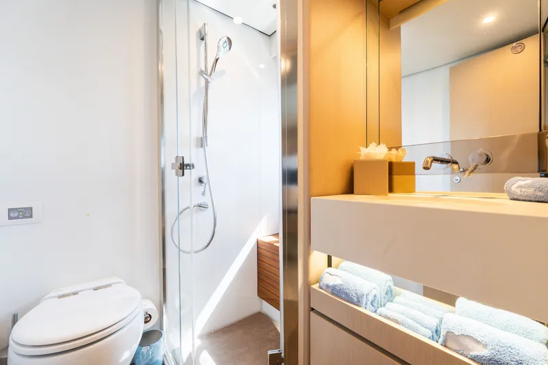 Slide: The Image of Luxurious bathroom in 2023 Azimut Fly 68 yacht, featuring modern shower and elegant vanity. - 44