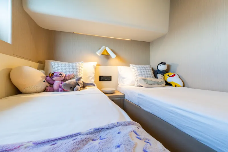 Slide: The Image of Twin beds with plush toys in 2023 Azimut Fly 68 yacht cabin. - 39