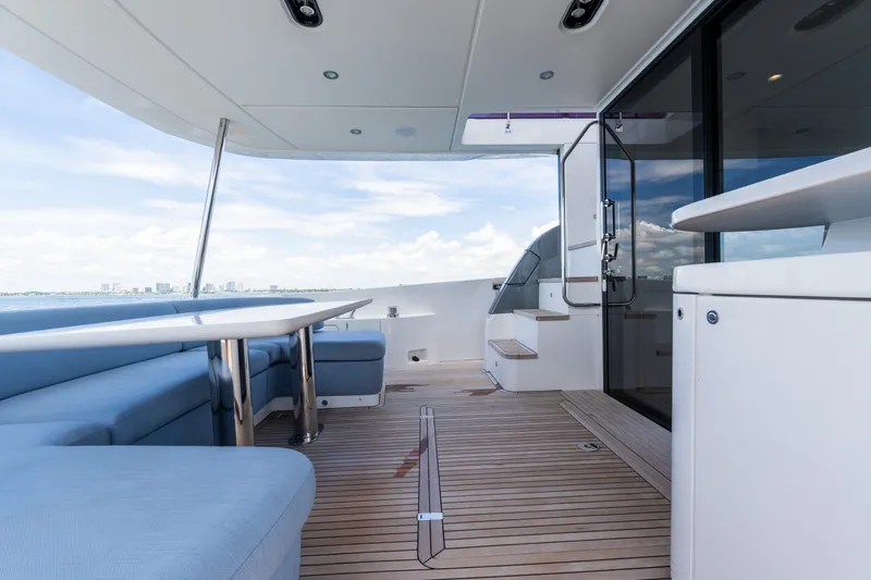 Slide: The Image of Luxurious deck of 2023 Azimut Fly 68 yacht with seating and ocean view. - 69