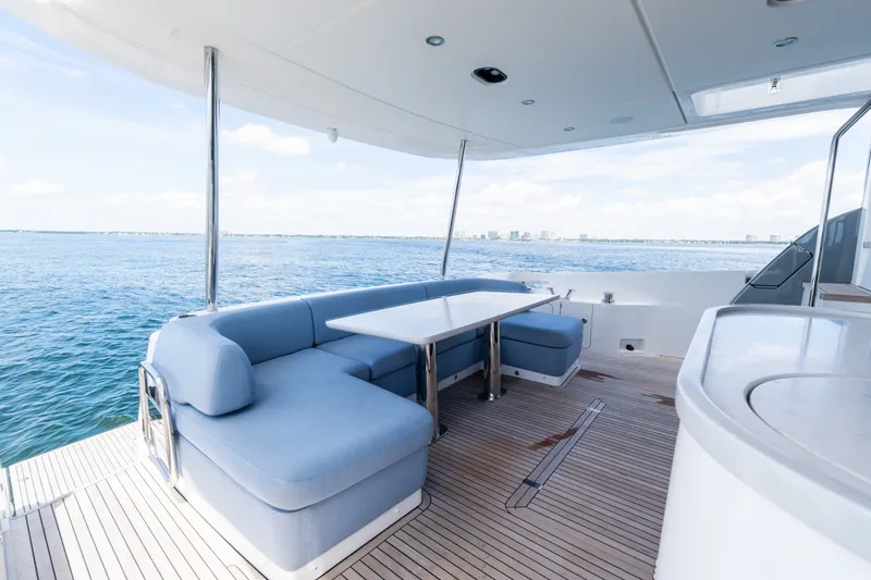 Slide: The Image of Luxurious 2023 Azimut Fly 68 yacht deck with elegant seating and ocean view. - 13