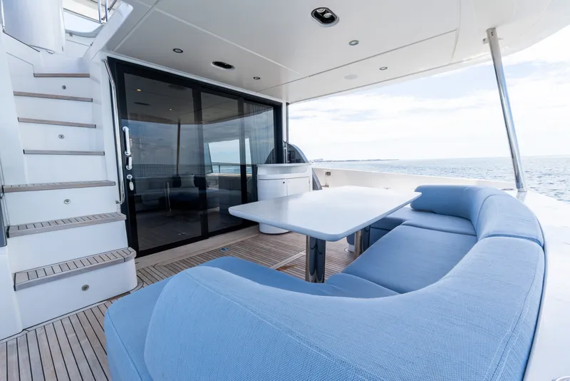 Slide: The Image of Luxurious 2023 Azimut Fly 68 yacht deck with elegant seating and ocean view. - 70