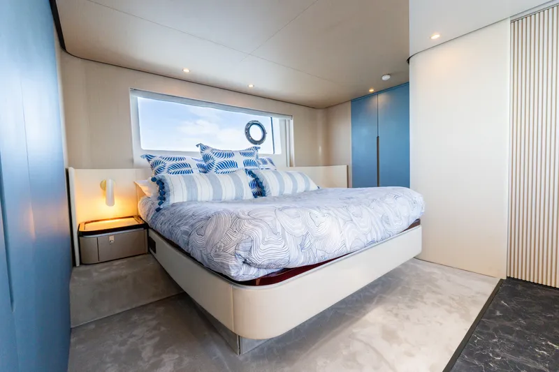 Slide: The Image of Luxurious bedroom interior of 2023 Azimut Fly 68 yacht with modern design and ocean view. - 32