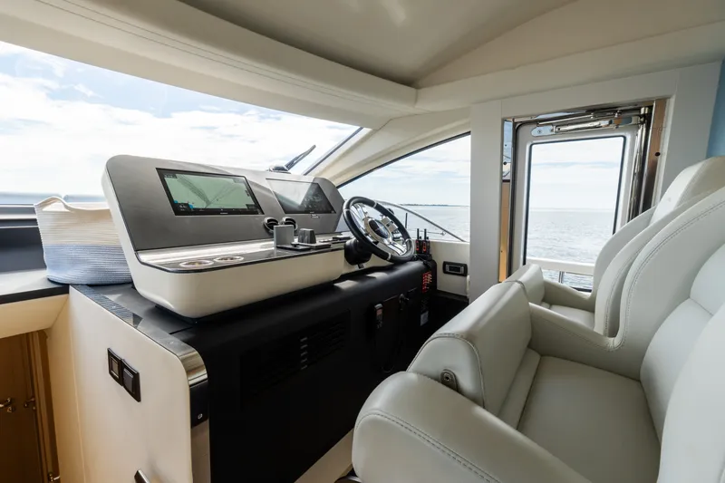 Slide: The Image of Luxurious helm of 2023 Azimut Fly 68 yacht with modern navigation systems. - 56