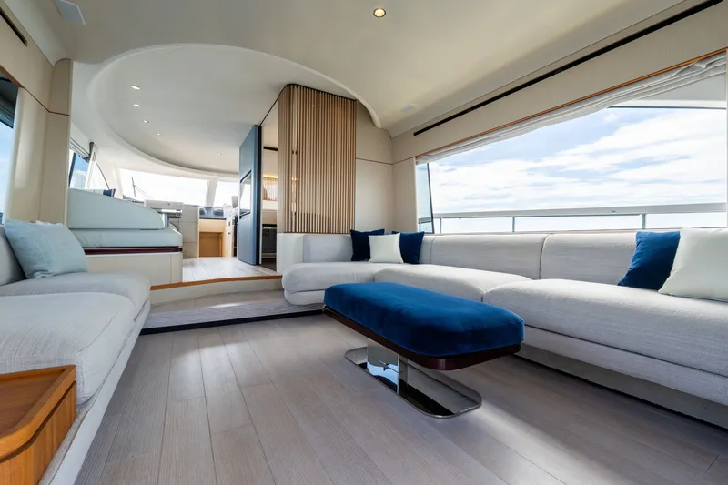 Slide: The Image of Luxurious interior of 2023 Azimut Fly 68 yacht with modern seating and panoramic windows. - 48