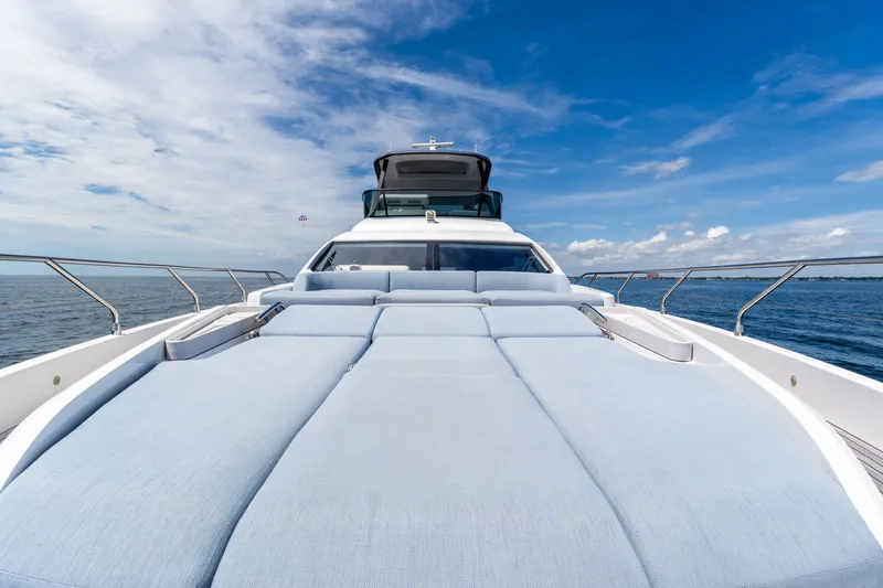 Slide: The Image of Luxurious 2023 Azimut Fly 68 yacht with spacious sunbathing deck on open sea. - 17