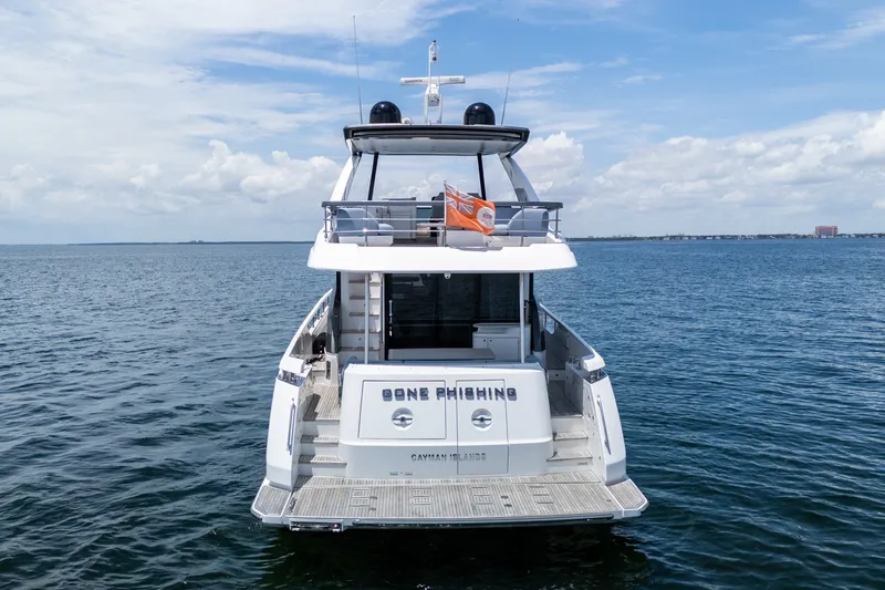 Slide: The Image of 2023 Azimut Fly 68 yacht on open water, rear view with clear skies. - 87