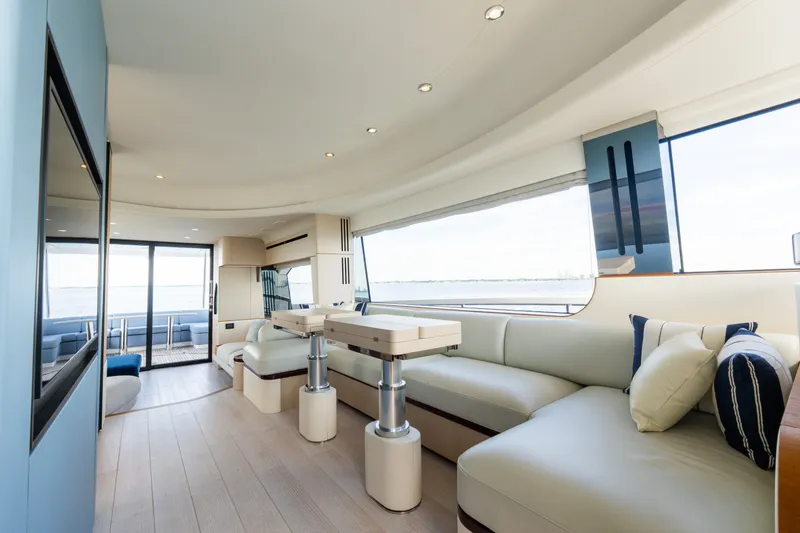 Slide: The Image of Luxurious interior of 2023 Azimut Fly 68 yacht with modern seating and panoramic windows. - 63