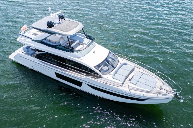 Slide: The Image of Luxurious 2023 Azimut Fly 68 yacht cruising on open water, showcasing sleek design and spacious deck. - 5