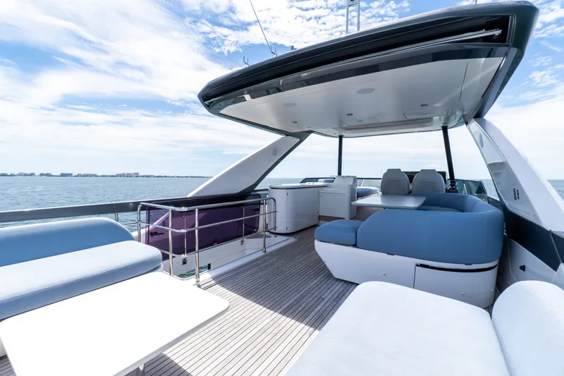 Slide: The Image of Luxurious 2023 Azimut Fly 68 yacht deck with modern seating and ocean view. - 76