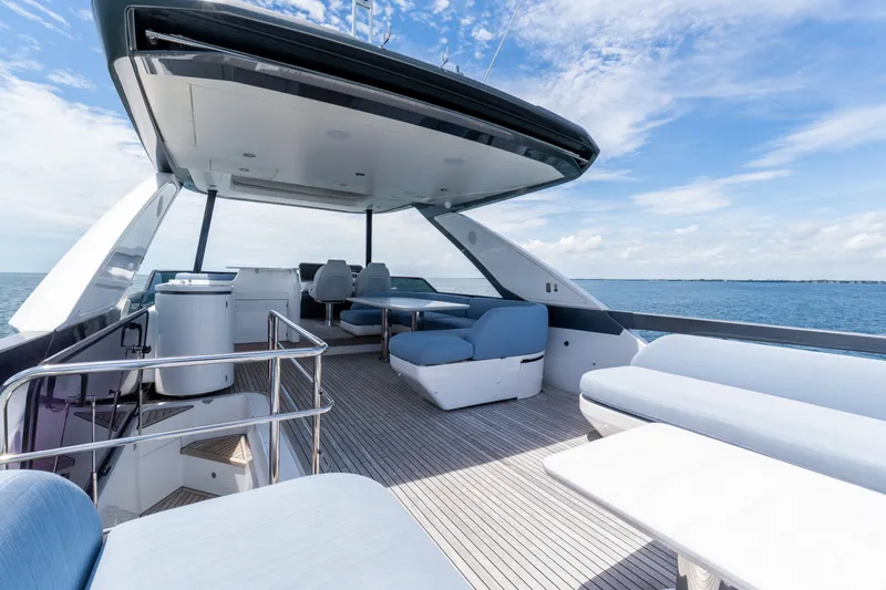 Slide: The Image of Luxurious 2023 Azimut Fly 68 yacht deck with modern seating and ocean view. - 22