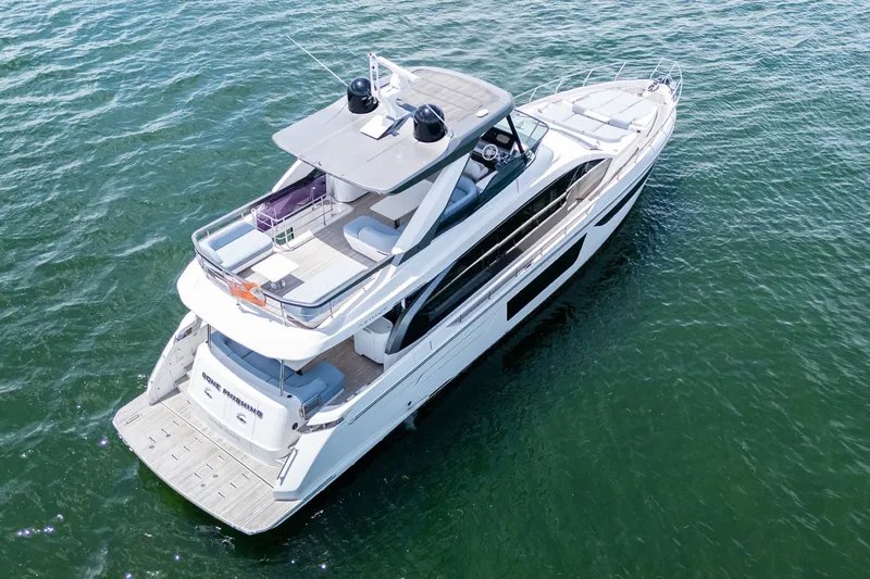 Slide: The Image of Aerial view of 2023 Azimut Fly 68 yacht cruising on open water. - 97