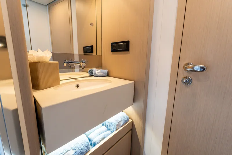 Slide: The Image of Luxurious bathroom interior of 2023 Azimut Fly 68 yacht with modern sink and storage. - 45