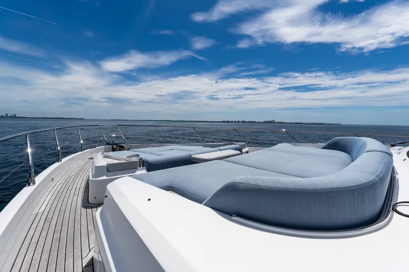 Slide: The Image of Luxurious Azimut Fly 68 yacht deck with plush seating, overlooking serene ocean waters. - 19
