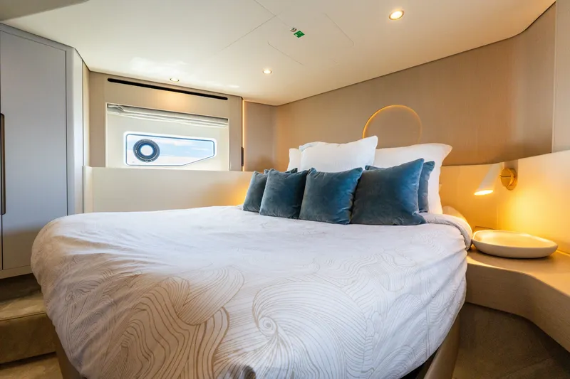 Slide: The Image of Luxurious bedroom interior of 2023 Azimut Fly 68 yacht with elegant bedding and ambient lighting. - 43