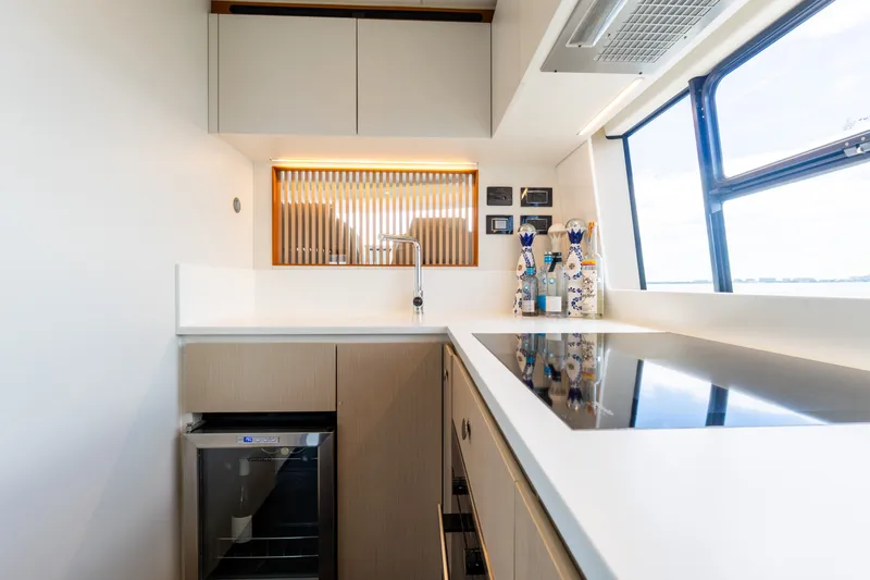 Slide: The Image of Modern kitchen interior on 2023 Azimut Fly 68 yacht, featuring sleek design and appliances. - 55