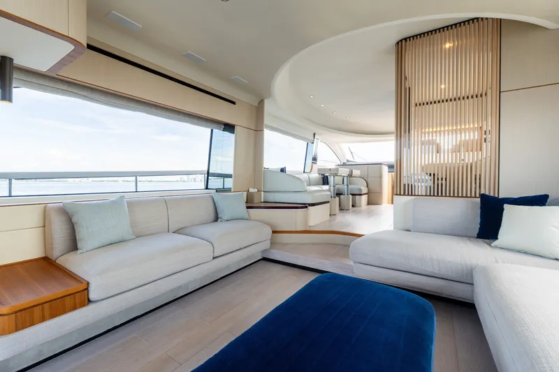 Slide: The Image of Luxurious interior of 2023 Azimut Fly 68 yacht with modern seating and panoramic windows. - 50