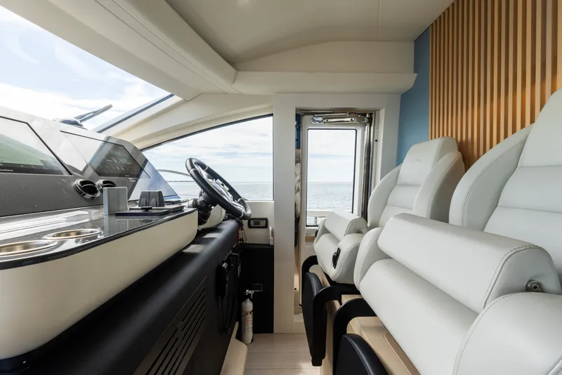 Slide: The Image of Luxurious interior of 2023 Azimut Fly 68 yacht with modern helm and plush seating. - 57