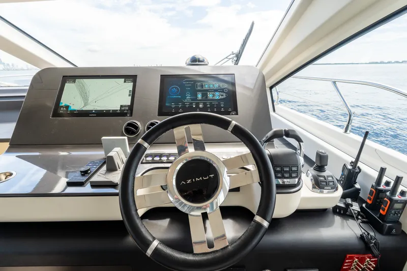 Slide: The Image of Cockpit of 2023 Azimut Fly 68 yacht with advanced navigation systems and controls. - 60
