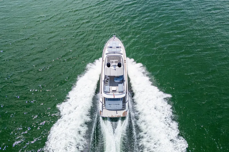 Slide: The Image of Aerial view of 2023 Azimut Fly 68 yacht cruising on open water. - 107