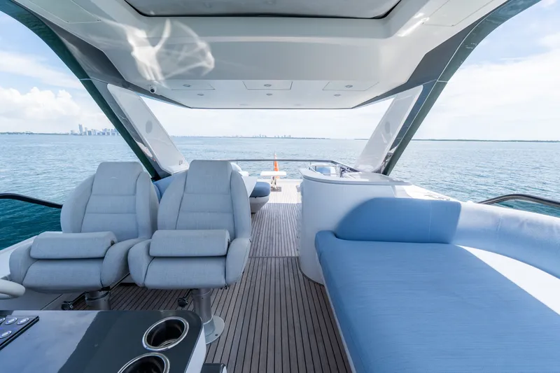 Slide: The Image of Luxurious 2023 Azimut Fly 68 yacht interior with plush seating and ocean view. - 81