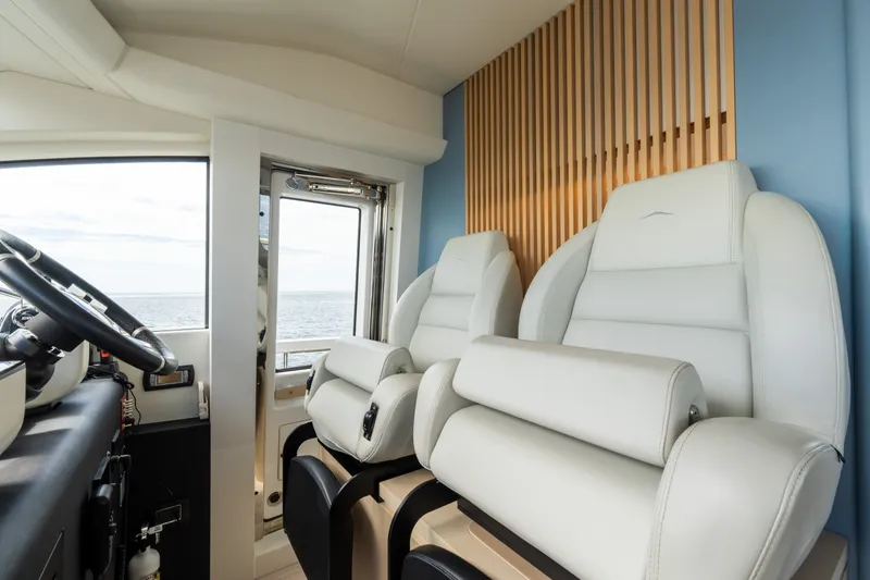 Slide: The Image of Luxurious interior of 2023 Azimut Fly 68 yacht with plush seating and ocean view. - 58