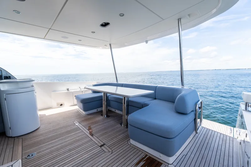 Slide: The Image of Luxurious 2023 Azimut Fly 68 yacht deck with elegant seating and ocean view. - 11