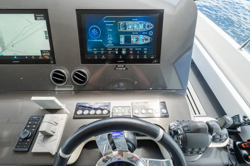 Slide: The Image of 2023 Azimut Fly 68 yacht helm with advanced navigation and control systems. - 62