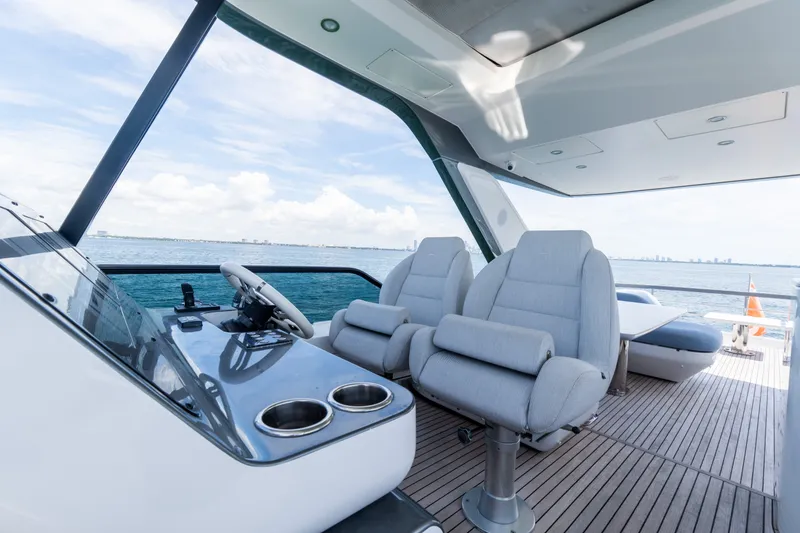 Slide: The Image of Luxury Azimut Fly 68 yacht cockpit with plush seating, ocean view, and modern design, 2023 model. - 79