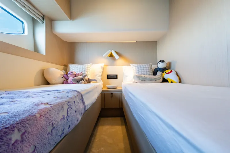 Slide: The Image of Luxurious twin cabin in 2023 Azimut Fly 68 yacht with plush bedding and soft toys. - 37