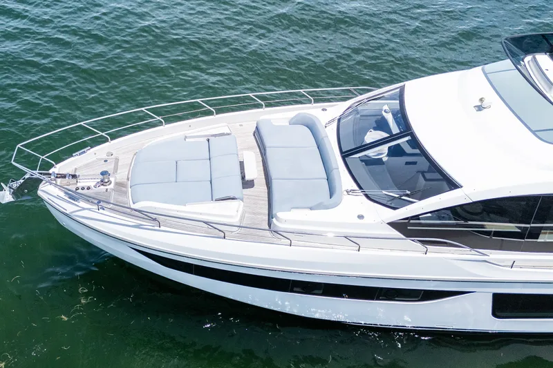 Slide: The Image of Luxury 2023 Azimut Fly 68 yacht cruising on serene waters. - 89