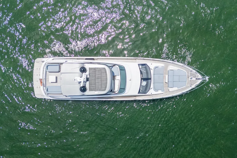 Slide: The Image of Aerial view of 2023 Azimut Fly 68 yacht on green water. - 98