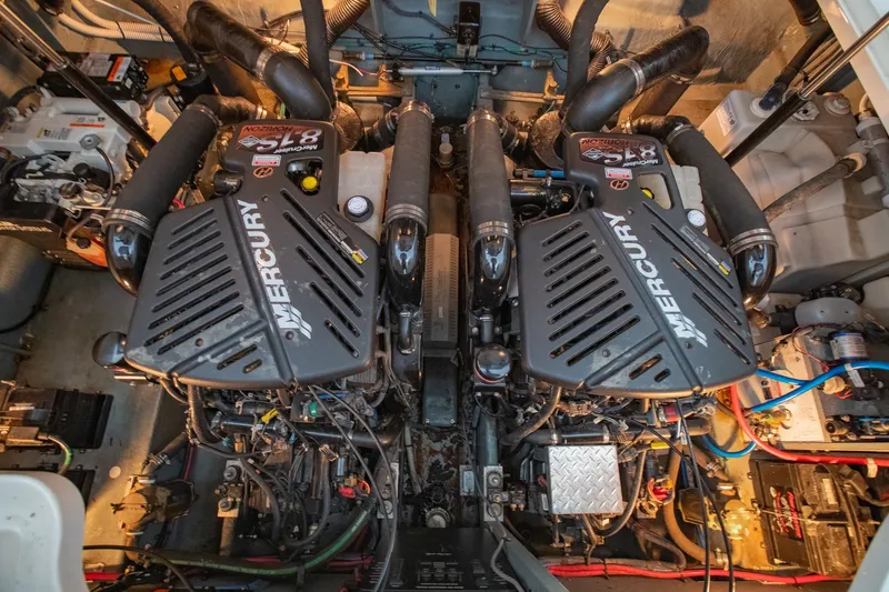 Slide: The Image of Engine room of a 2004 Sea Ray 340 Sundancer with twin Mercury engines. - 42