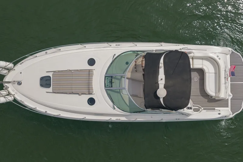 Slide: The Image of Top view of a 2004 Sea Ray 340 Sundancer yacht on water. - 4