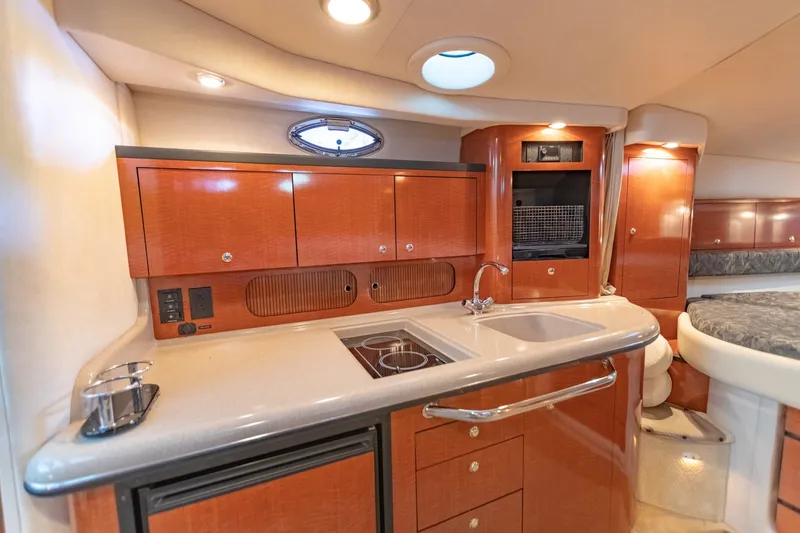 Slide: The Image of Luxurious 2004 Sea Ray 340 Sundancer yacht interior with modern kitchen amenities. - 33