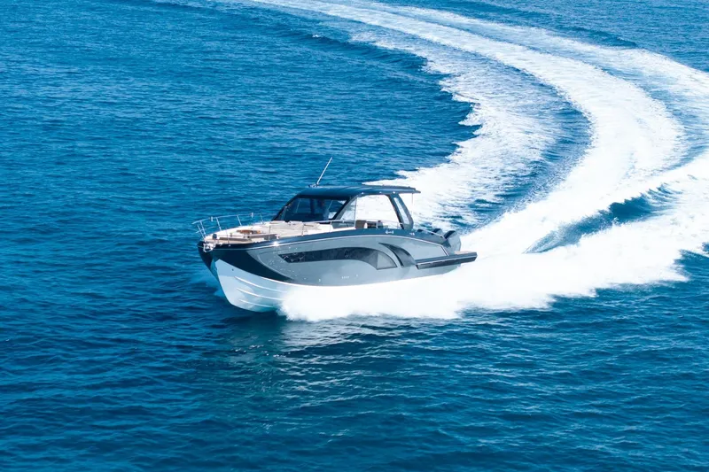 Slide: The Image of 2026 Hanover 447 yacht cruising swiftly on open blue sea. - 9