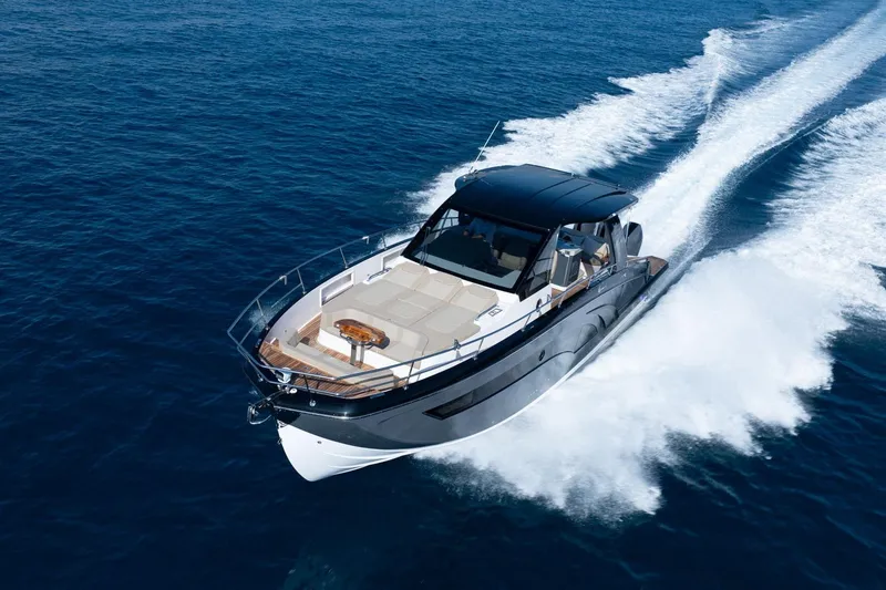 Slide: The Image of Luxurious 2026 Hanover 447 yacht cruising swiftly on open blue sea. - 5
