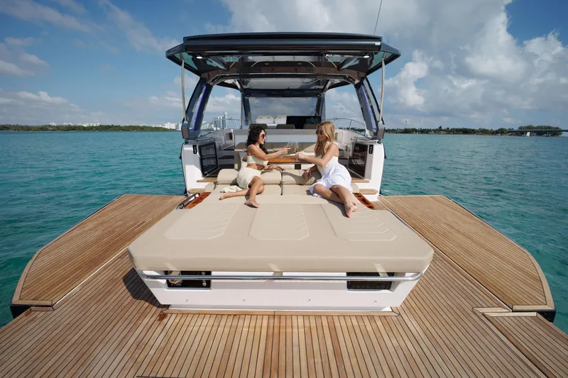 Slide: The Image of Two people relaxing on a Hanover 447 yacht, 2026 model, enjoying the ocean view. - 29