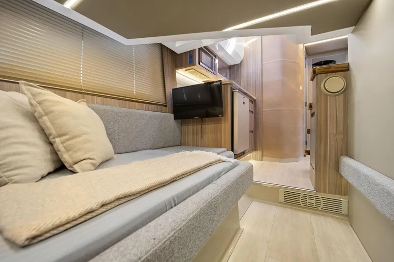 Slide: The Image of Luxurious interior of 2026 Hanover 447 RV with modern amenities and cozy seating. - 46