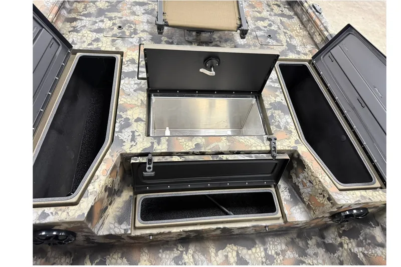 Slide: The Image of 2027 Thor BH1900CC boat interior with open storage compartments and camouflage design. - 14