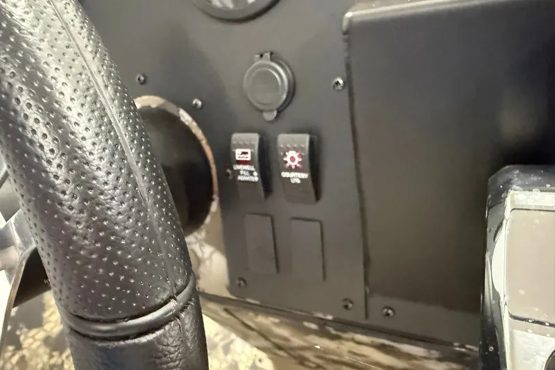 Slide: The Image of Close-up of Thor BH1900CC 2027 dashboard with switches and steering wheel detail. - 10