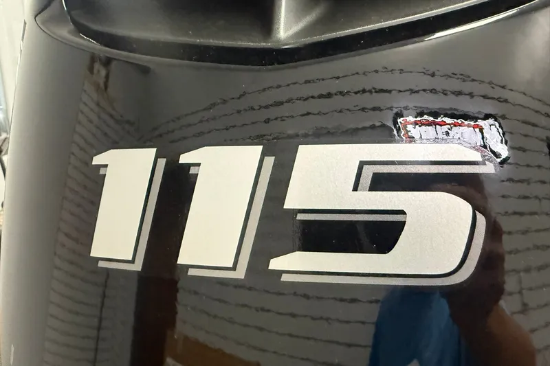 Slide: The Image of Close-up of Thor BH1900CC 2027 model with '115' decal on black surface. - 5