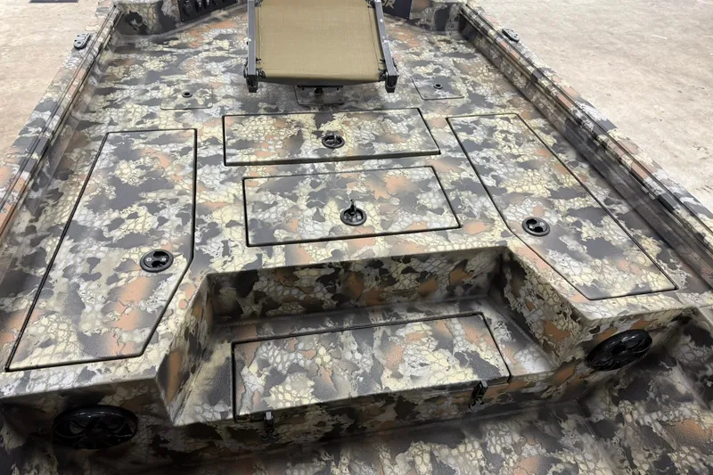 Slide: The Image of Camouflage-patterned interior of 2027 Thor BH1900CC boat with storage compartments. - 13
