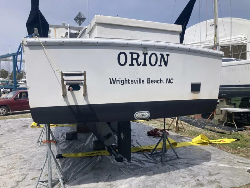 Slide: The Image of The stern of a boat named "ORION" from Wrightsville Beach, NC, is on a dry dock. - 43