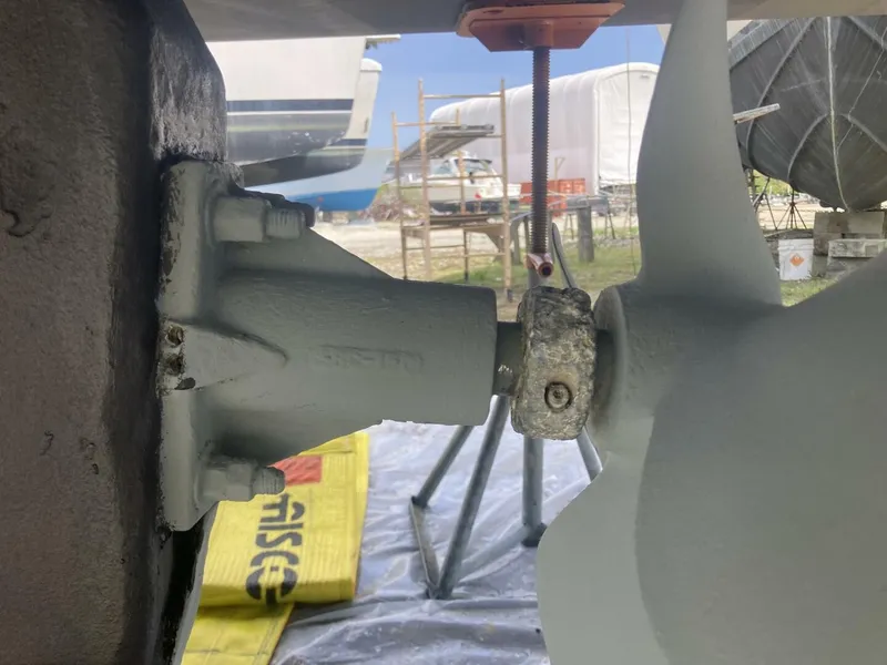 Slide: The Image of Close-up of a boat propeller and its shaft in a boatyard. - 36