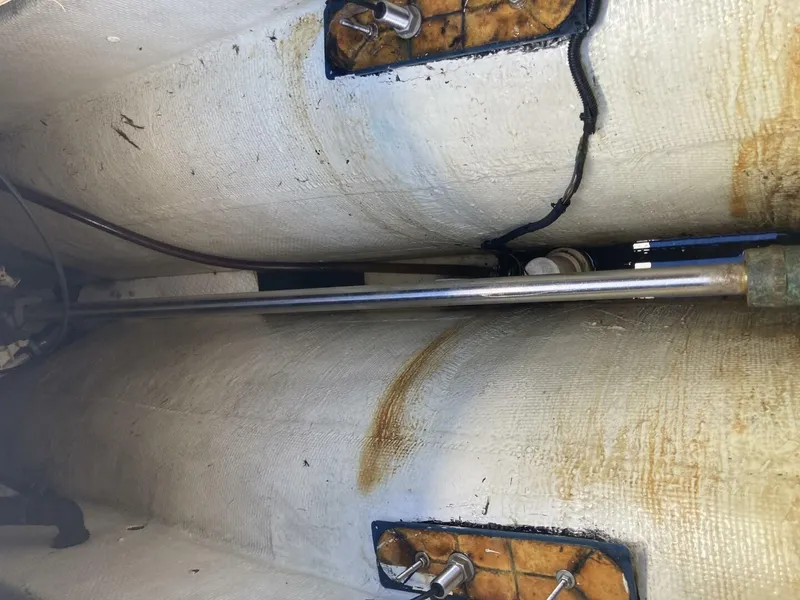 Slide: The Image of Interior view of a boat with metal rods and cables running through the hull. - 8