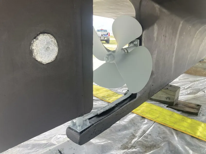Slide: The Image of Close-up of a boat rudder and propeller in a shipyard. - 37