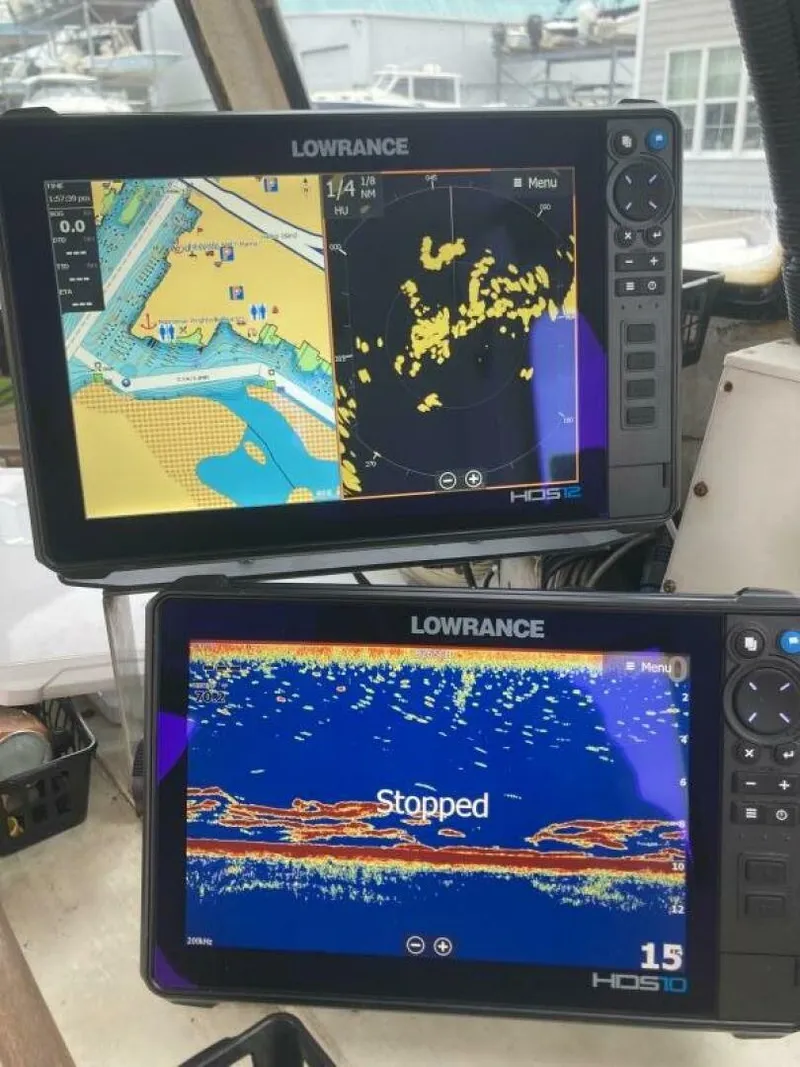 Slide: The Image of Two Lowrance screens display navigation and sonar data on a boat. - 27