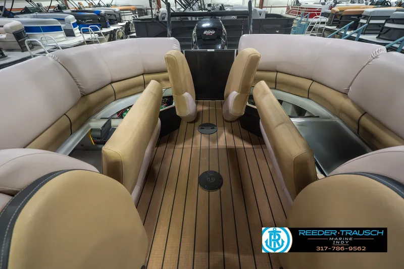 Slide: The Image of 2017 South Bay 725 RS pontoon boat interior with beige seating and wood flooring. - 34