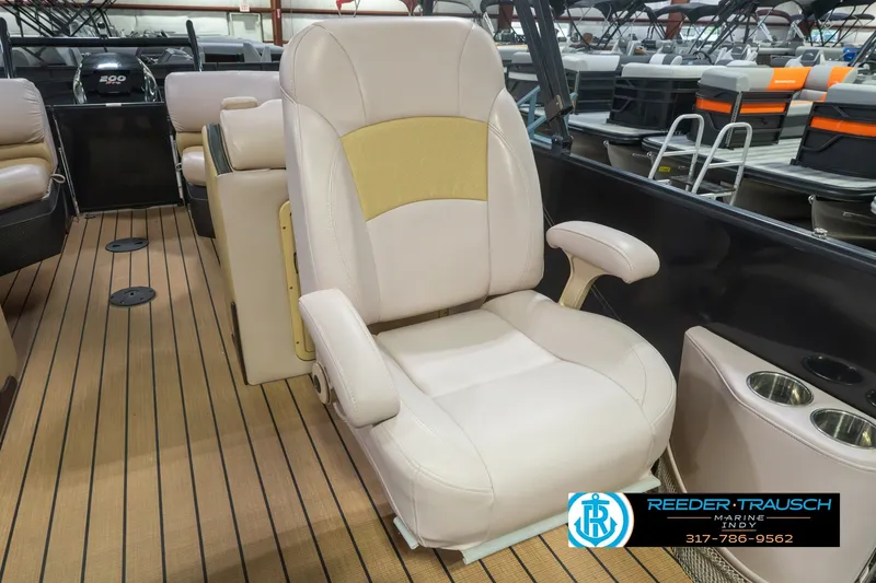 Slide: The Image of 2017 South Bay 725 RS boat interior with beige captain's chair and wood flooring. - 44