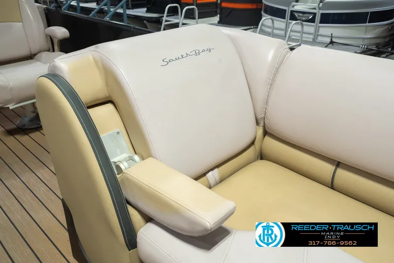Slide: The Image of Luxurious seating on a 2017 South Bay 725 RS pontoon boat, featuring beige upholstery. - 29